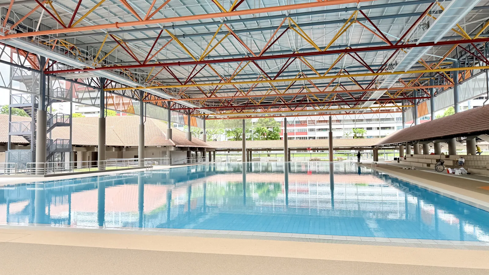 Covered teaching pool under the steel-truss roof at Hougang Swimming Complex